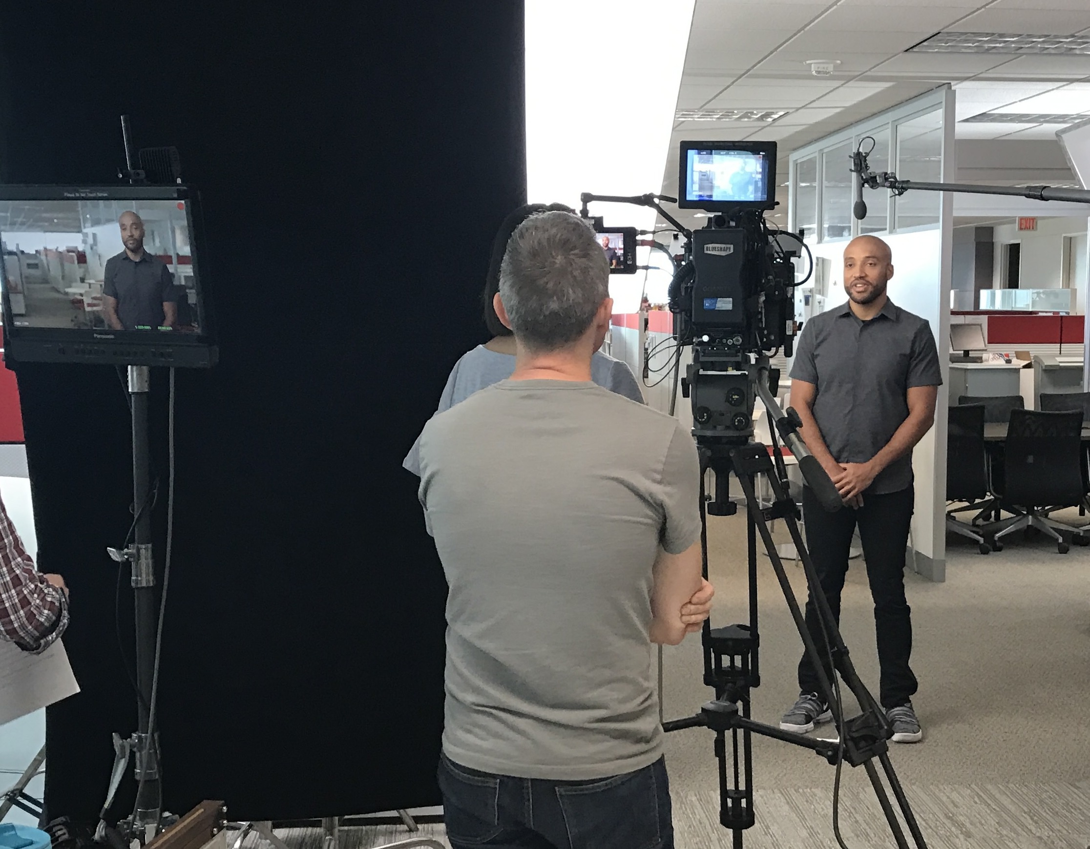 Jarrett Reed speaking on camera during a corporate production